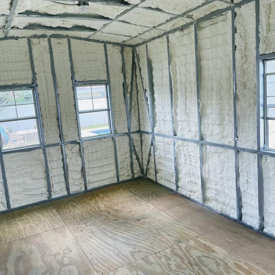 Closed-cell spray foam insulation applied to wall cavities in a residential project in Forest City
